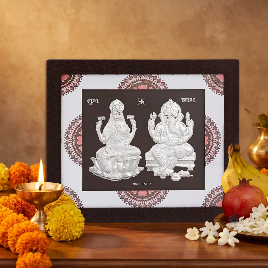 Lord Ganesha & Laxmiji framed silver artwork, showcasing symbols of wealth and prosperity in intricate design.