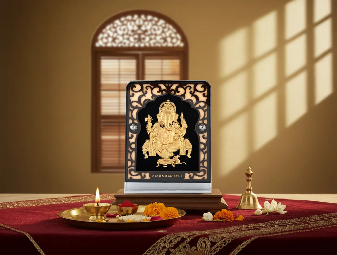 Silver frame 24KT gold Ganeshji stand tabletop display, 4x3 inches, with intricate design and glass tabletop from Bhagwati Jewels.