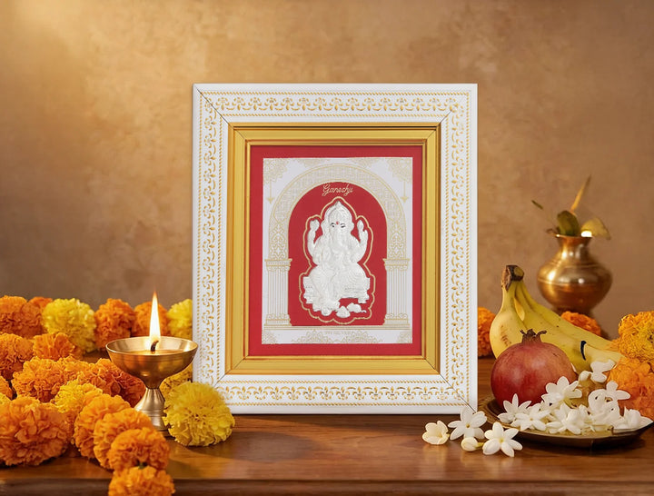 Silver Ganesh frame from Bhagwati Jewels featuring intricate design, perfect for divine home decor display.
