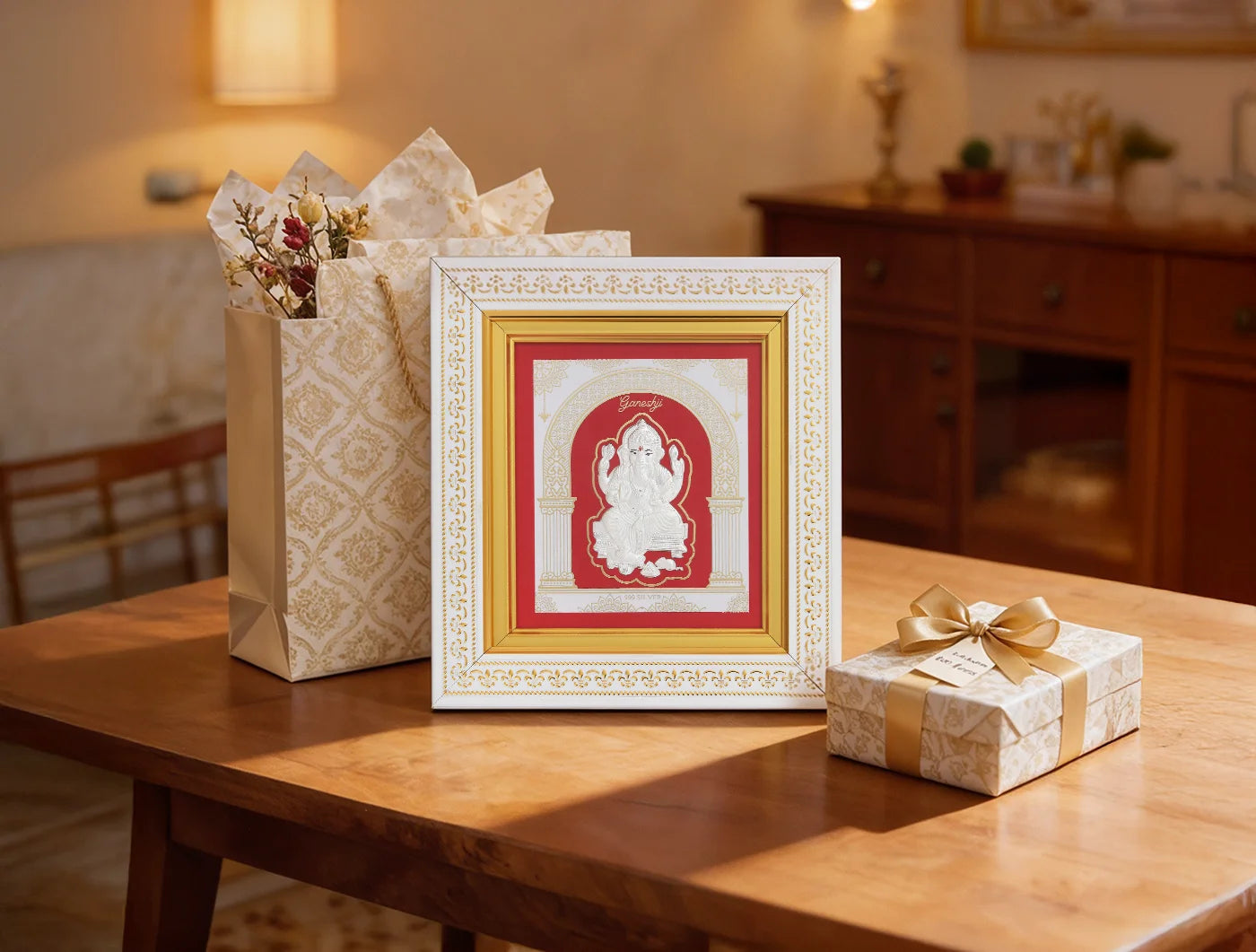 Silver Ganesh frame from Bhagwati Jewels featuring intricate detailing, perfect for divine home decor displays.