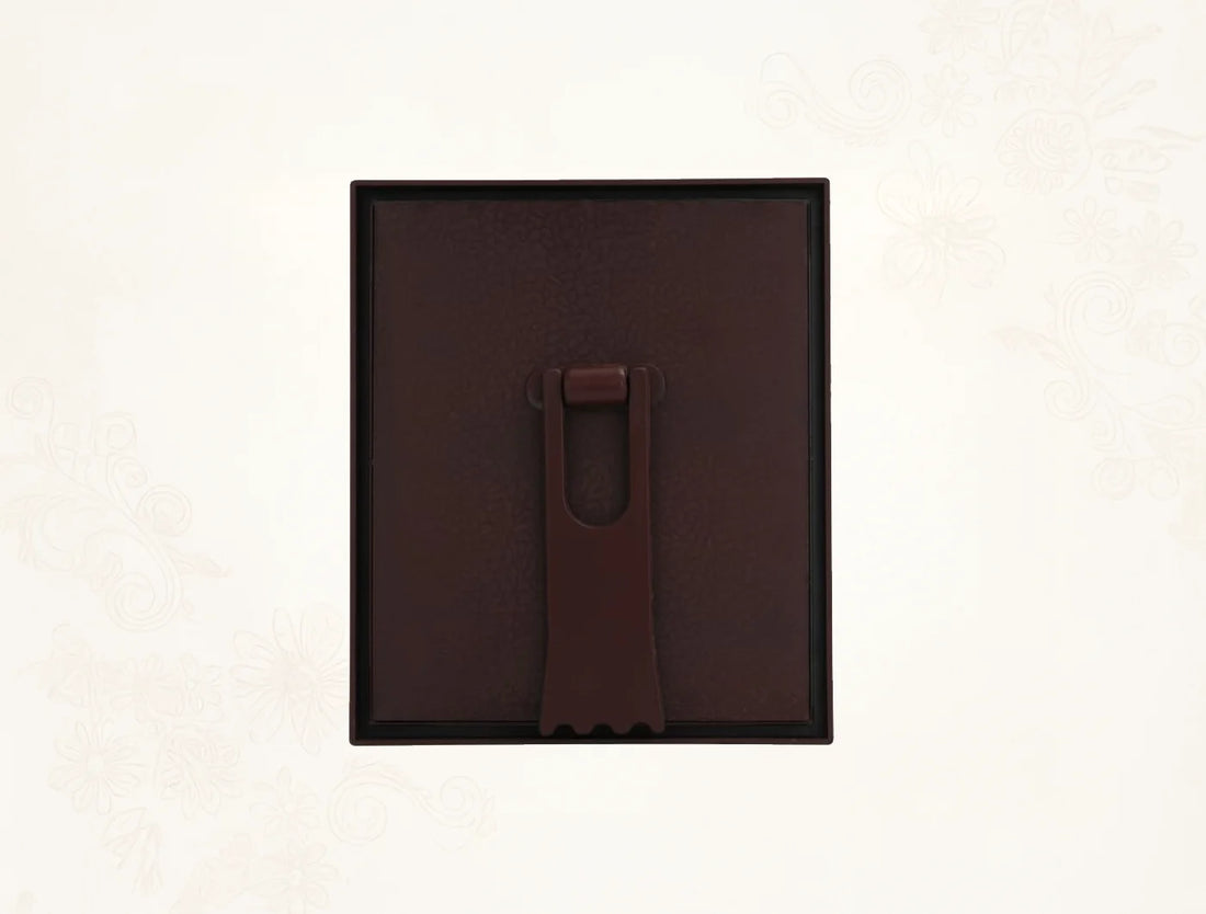 Back view of a 999 Pure Silver Ashta Ganesh Frame with a brown mounting hook for wall hanging.