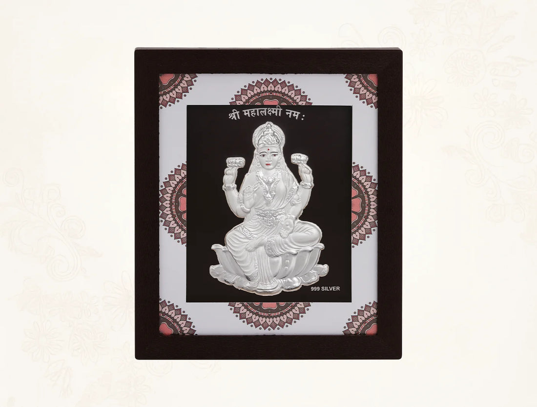 Hanging pure silver Laxmiji frame by Bhagwati Jewels, decorative home or office decor with intricate design and divine motif.