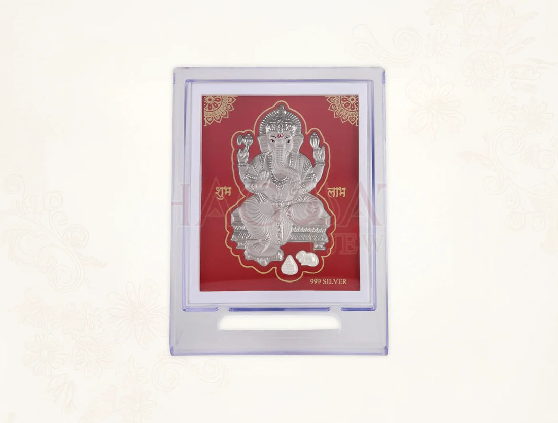 Silver Ganesh figurine displayed on a 7x5 inch acrylic square stand, showcasing a silver frame design for home decor.
