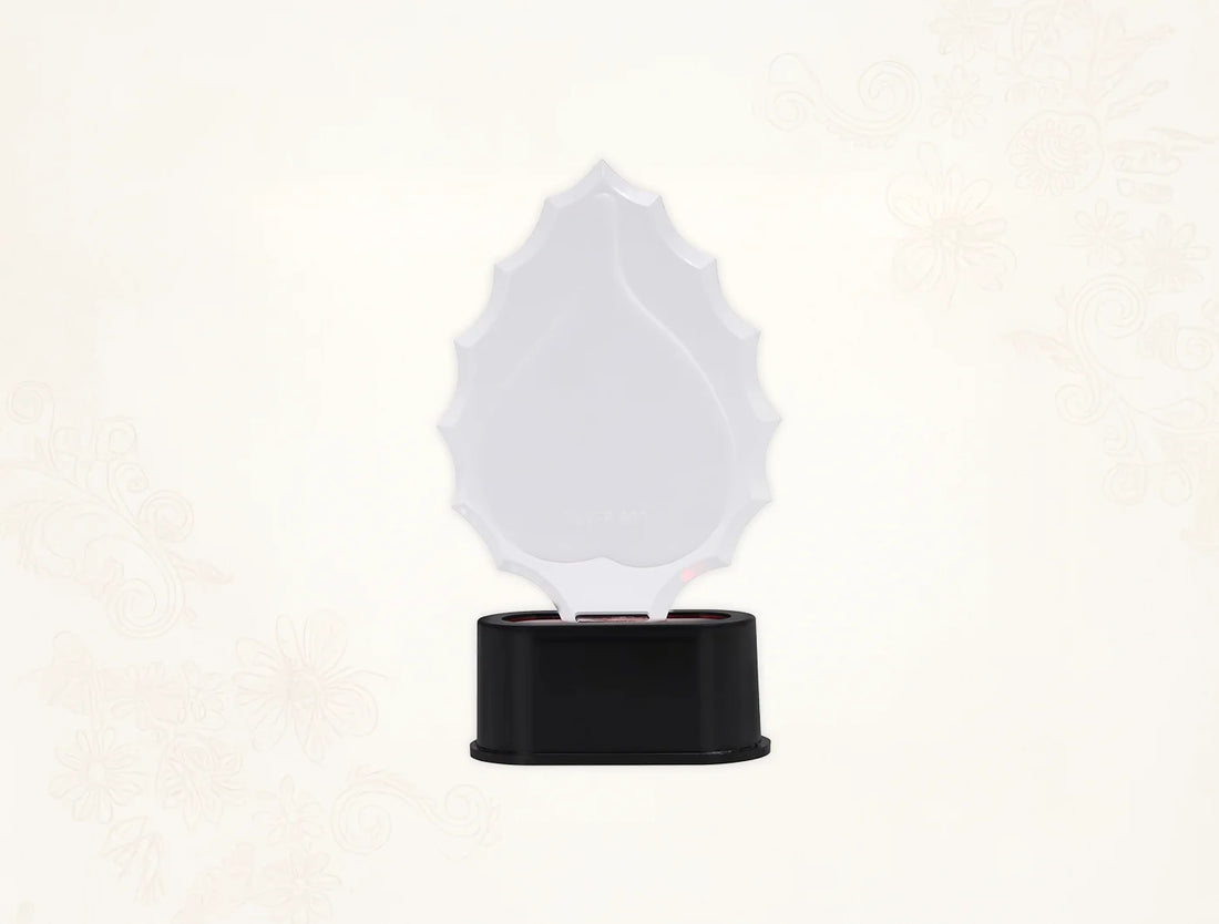 999 Pure Silver Ganesha Trophy Stand on a black base, decorative tabletop piece, 7 inches by 3.5 inches.
