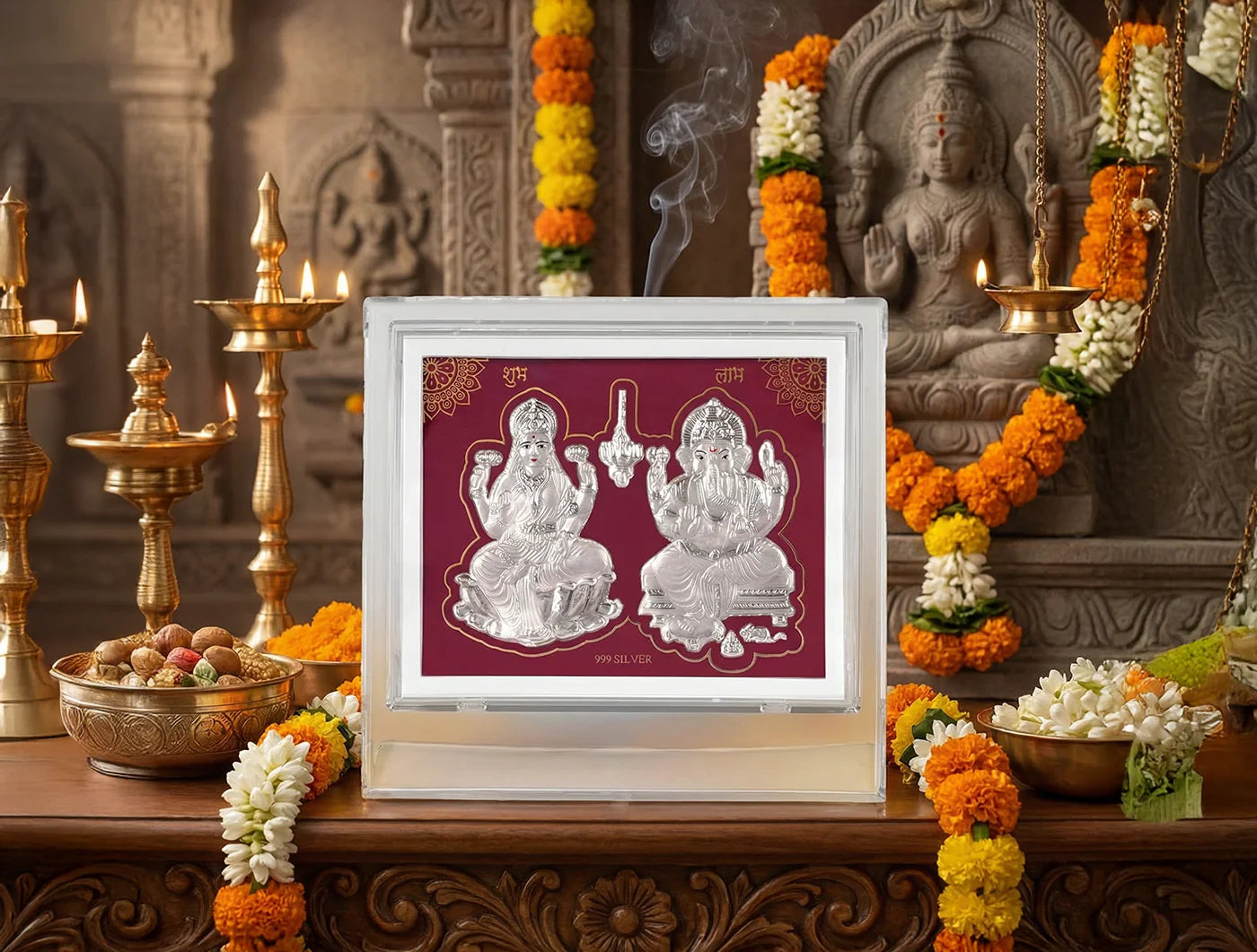 Silver Laxmi Ganesh figurine on a 7x5 inch acrylic stand, crafted from 999 pure silver, displayed in a decorative tabletop frame.