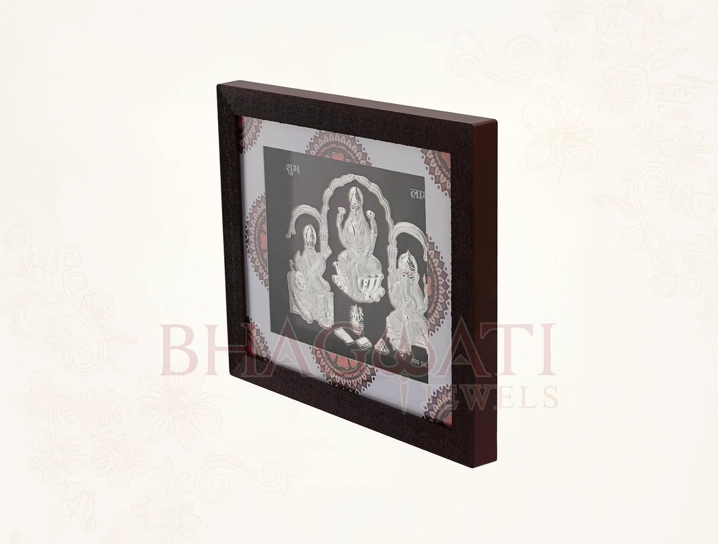 Square silver frame featuring Laxmi, Ganesh, and Saraswati images in 999 pure silver for home or office display.
