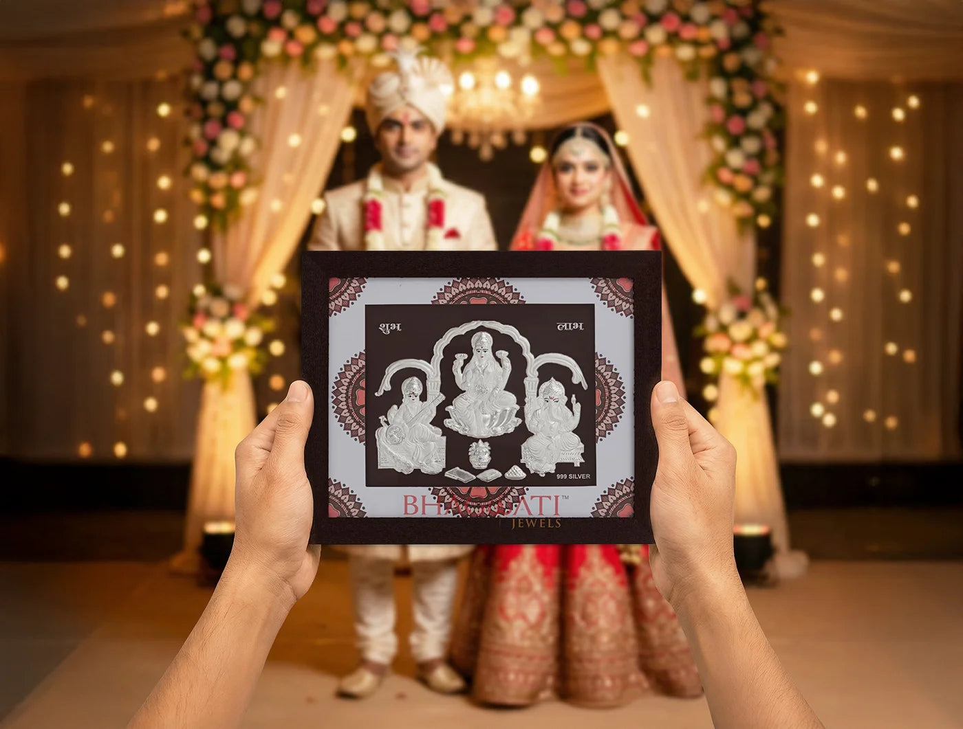 Square silver frame featuring Laxmi, Ganesh, and Saraswati images by Bhagwati Jewels, 7x6 inches, ideal for home or office display