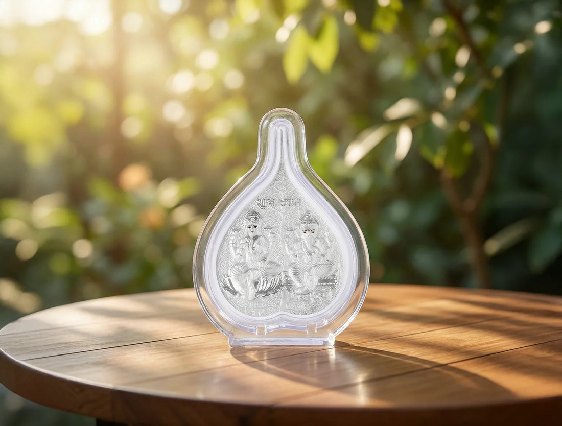 Silver Laxmi Ganesha frame by Bhagwati Jewels, 4.25 x 3 inches, featuring pure silver craftsmanship for spiritual or corporate gifting.