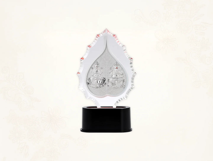 Silver frame of Laxmi Ganesha Pan Trophy by Bhagwati Jewels, featuring intricate silver craftsmanship and a decorative stand.