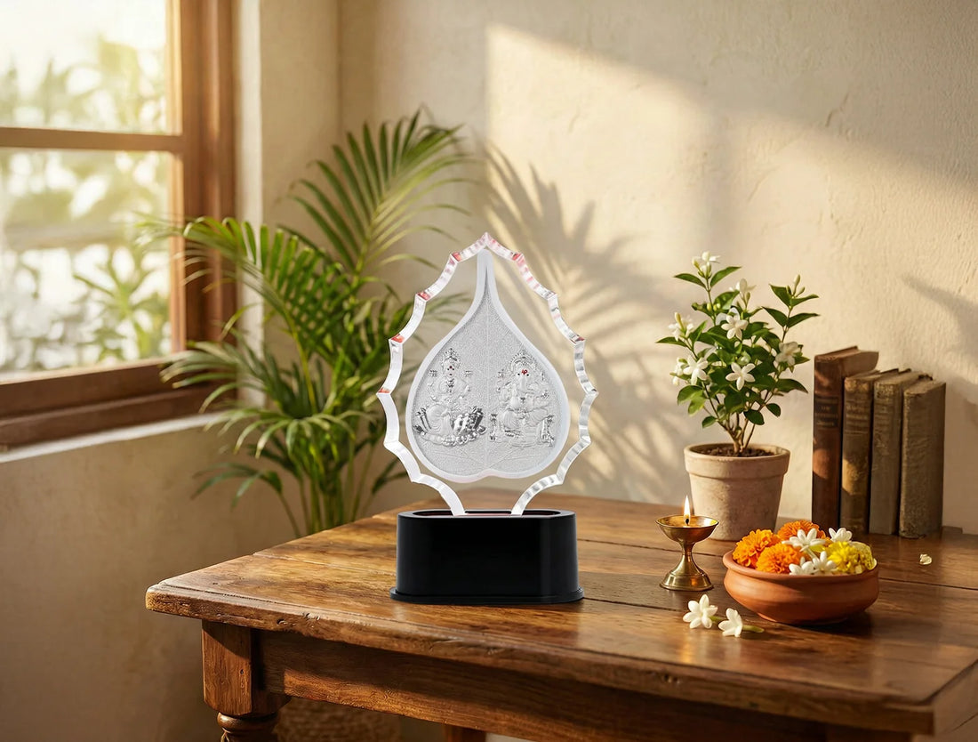 Silver Laxmi Ganesha trophy stand in a decorative frame, crafted from 999 silver by Bhagwati Jewels, featuring intricate design.