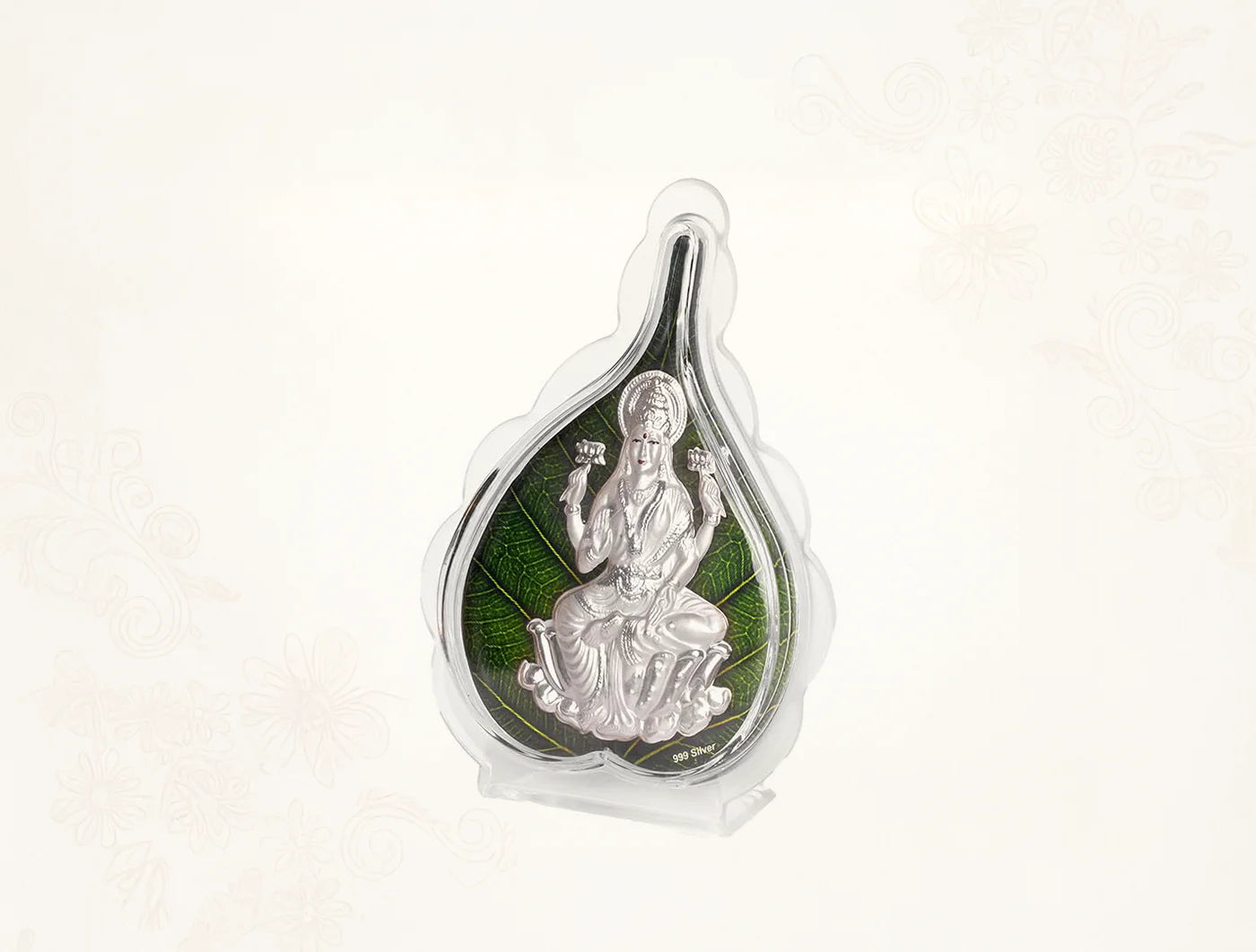 999 Pure Silver Laxmi Green Pan Stand displayed in a protective case with a green leaf design, perfect for decor.