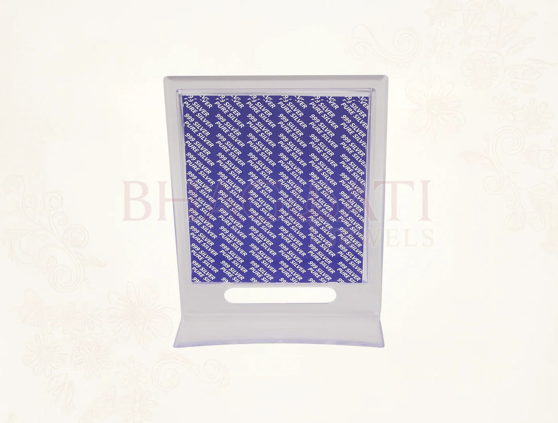 Silver frame stand featuring Laxmiji image in a 7x5 inch acrylic rectangle, crafted by Bhagwati Jewels in pure silver.