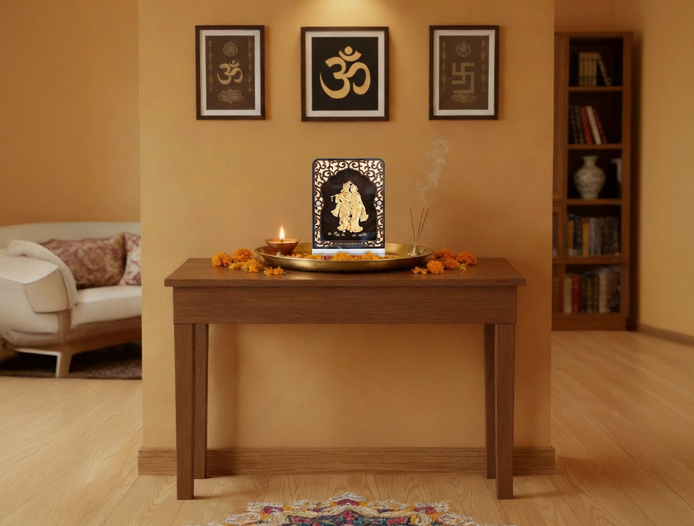 24KT Gold Radhakrishna Tabletop Stand displayed on a wooden table with decorative elements in a cozy room.