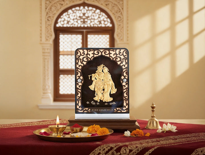 24KT Gold Radhakrishna Tabletop Stand displayed elegantly on a decorative table with traditional Indian decor.