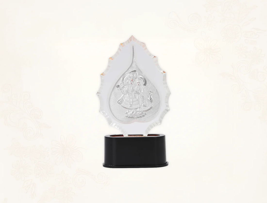 Pure Radhakrishna trophy stand in silver with idol for home temple decor, featuring a 7-inch tabletop design by Bhagwati Jewels.