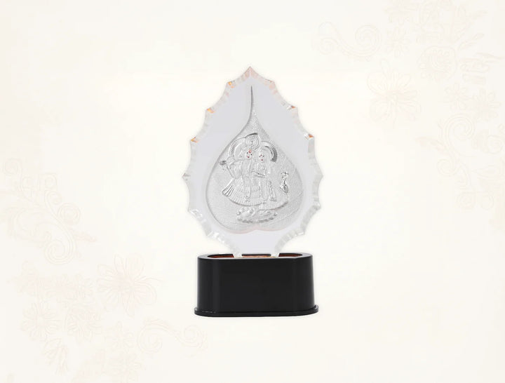 Pure Radhakrishna trophy stand in silver with idol for home temple decor, featuring a 7-inch tabletop design by Bhagwati Jewels.