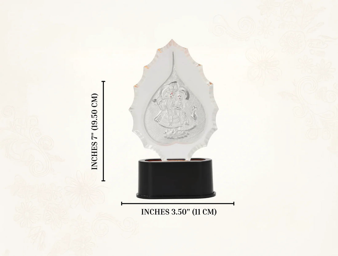 Silver Radhakrishna trophy stand with idol, 7-inch tabletop silver frame for home temple puja, crafted by Bhagwati Jewels.
