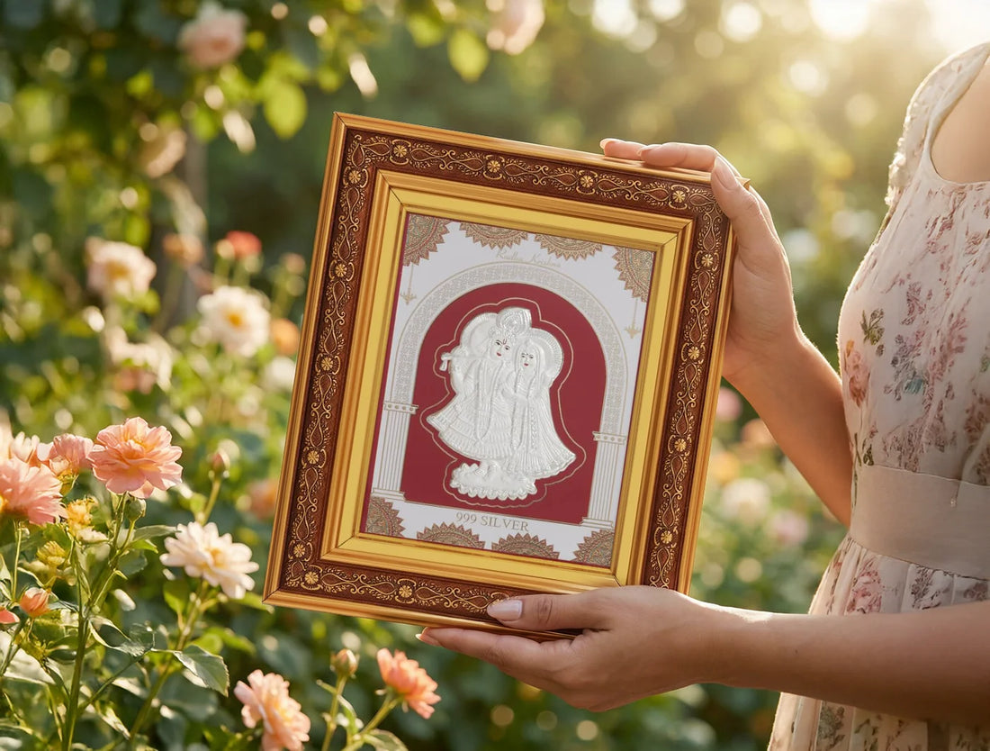 Square silver Radhakrishna wall mount frame with copper backing, crafted by Bhagwati Jewels, featuring detailed religious iconography.