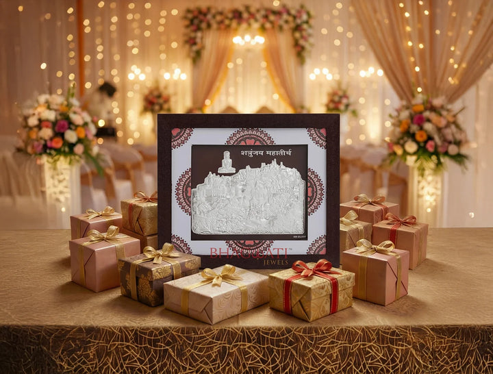 999 Pure Silver Shetrunjay Frame displayed with gift boxes at a decorated event, highlighting its elegance and design.