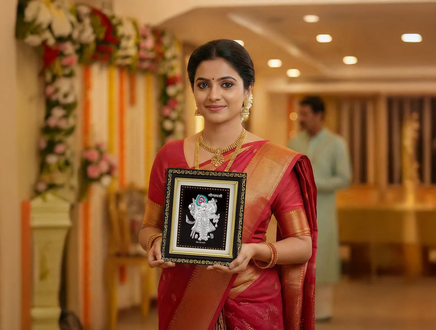 Gold frame photo of Shrinathji in 999 pure silver, 5.5 x 5 inches, from BHAGWATI JEWELS, showcasing intricate detailing.