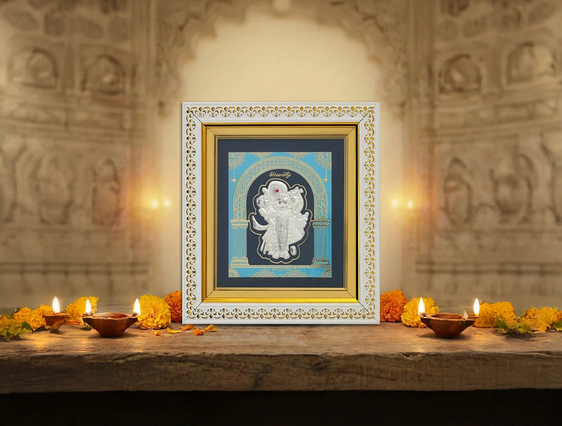 Shrinathji silver hanging wall frame in 8x7.5 inches, made of 999 pure silver, with intricate design by Bhagwati Jewels.