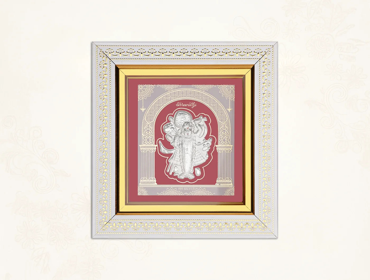 Silver frame featuring Lord Shrinathji in 999 pure silver, wall-mounted hanging frame measuring 8x7.5 inches.