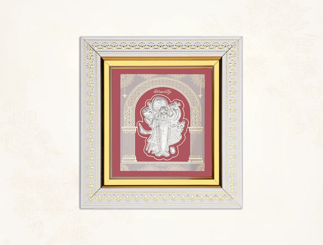 Silver frame featuring Lord Shrinathji in 999 pure silver, wall-mounted hanging frame measuring 8x7.5 inches.